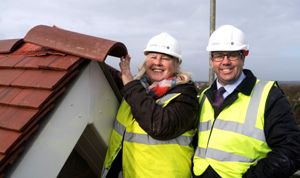 Sue Glanz, Caring Homes regional operations director and Kevin Coleman, Caring Homes construction manager celebrate topping out ceremony