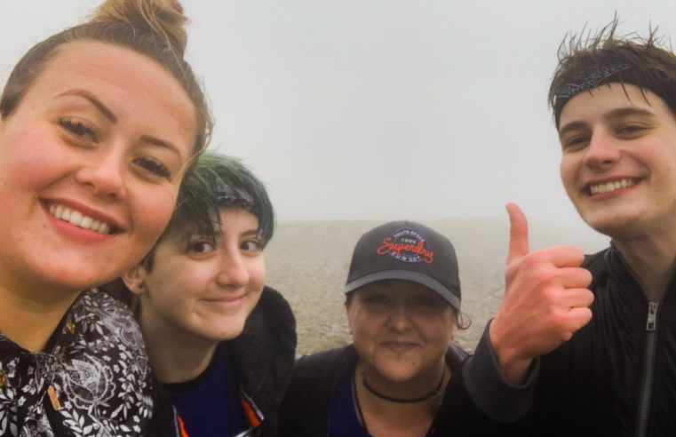 Four care workers from the Kanner Project in Plymouth have scaled Mount Snowdon to raise money for charity and a memorial for a colleague who passed away in August.