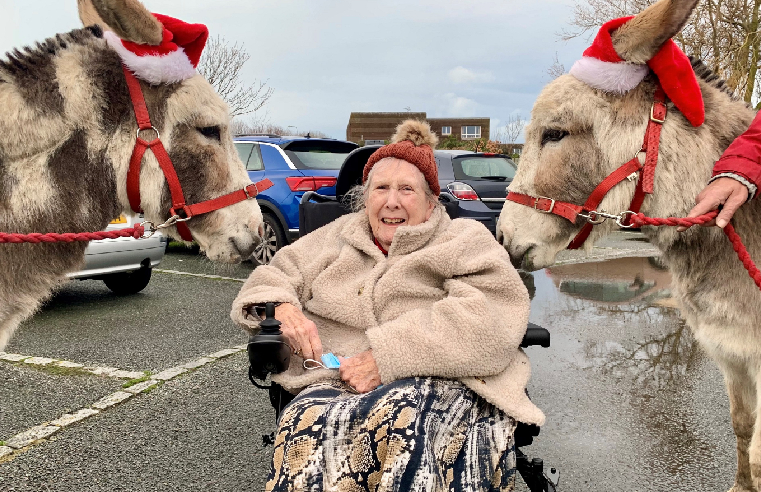 RMBI Home Queen Elizabeth Court resident Christine Goody with rescue donkey twins Ant and Dec