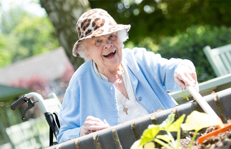 A resident at RMBI Care Co. Home Connaught Court enjoying some gardening.