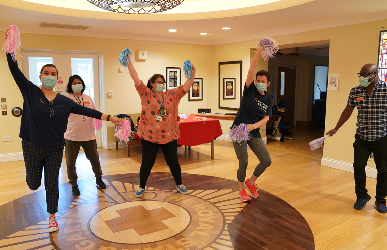 Staff rehearsing for a special dance recital performed at the barbecue.