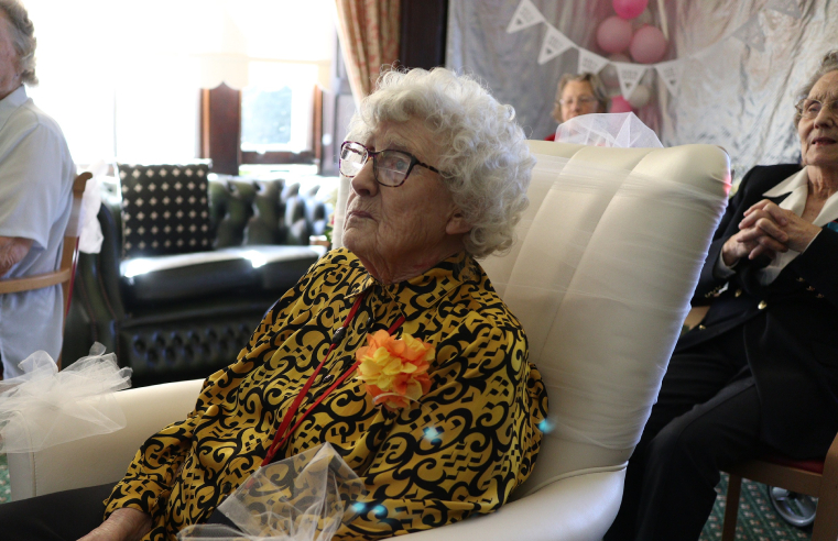 RMBI Home Prince Edward Duke of Kent Court resident Dot Bash watching a live stream of her granddaughterâ€™s wedding with fellow residents. 