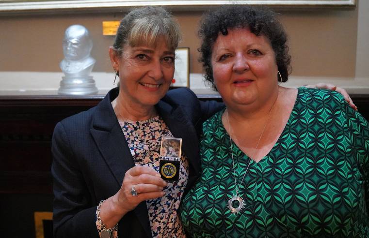 Pauline Shaw with her Chief Nurse Adult Social Care Gold Award, given to her by Professor Deborah Sturdy (right)