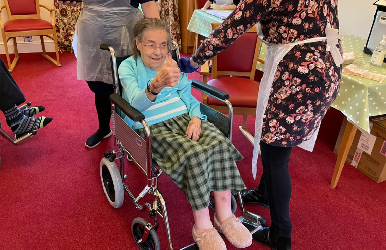 Gladys Leaf, resident at The Manor House, receiving her COVID-19 vaccination.