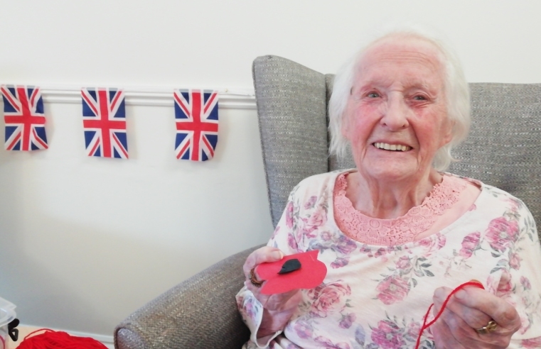 esident Queenie Watts, aged 89, assisted Activities Co-Ordinator Joanna Furtak with decorating the home with handcrafted poppies hanging from the ceiling. The wall of the lounge has been decorated with poppies, wreaths and flags.